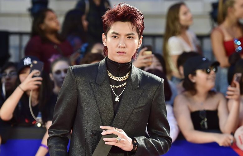 FILE – Singer Kris Wu celebrates his award for Fan Fave New Artist on the red carpet at the iHeartRadio MMVAs in Toronto on Aug. 26, 2018. A Beijing court on Friday, Nov. 25, 2022 sentenced Chinese-Canadian pop star Kris Wu to 13 years in prison on charges including rape. (Frank Gunn/The Canadian Press via AP, File) XBEJ201 XBEJ201