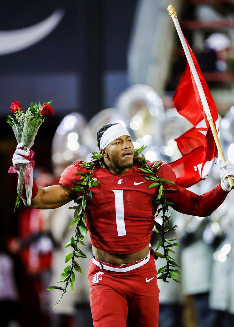 Washington State linebacker Daiyan Henley stands on the field during the  second half of an NCAA college football game against Utah, Thursday, Oct.  27, 2022, in Pullman, Wash. (AP Photo/Young Kwak Stock