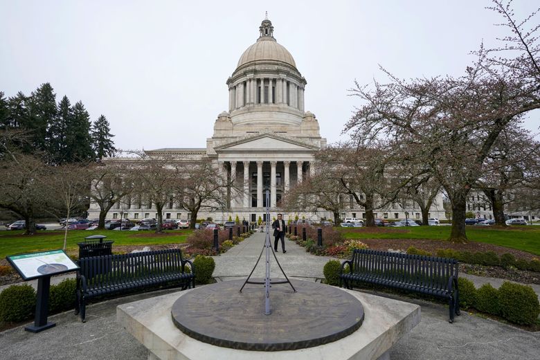 The sun dial near the Legislative Building is shown under cloudy skies, Thursday, March 10, 2022, at the Capitol in Olympia, Wash. Washington lawmakers were wrapping up their work Thursday before planning to adjourn the legislative session.