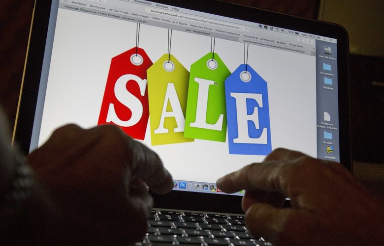 In this Dec. 12, 2016, photo, a person searches the internet for sales, in Miami. Days after flocking to stores on Black Friday, consumers are turning online for Cyber Monday to score more discounts on gifts and other items that have ballooned in price because of high inflation. Adobe Analytics, which tracks transactions for top online retailers, forecasts Cyber Monday will remain the yearâ€™s biggest online shopping day and rake in up to $11.6 billion in sales. (AP Photo/Wilfredo Lee) NYPS204 NYPS204