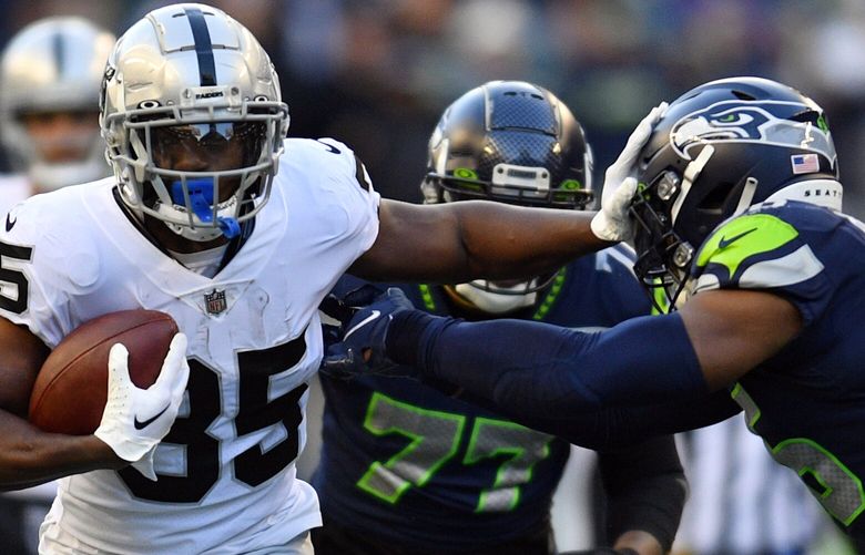 Las Vegas Raiders running back Zamir White carries against the Seattle Seahawks during the second half of an NFL football game Sunday, Nov. 27, 2022, in Seattle. (AP Photo/Caean Couto) CAMS321 CAMS321