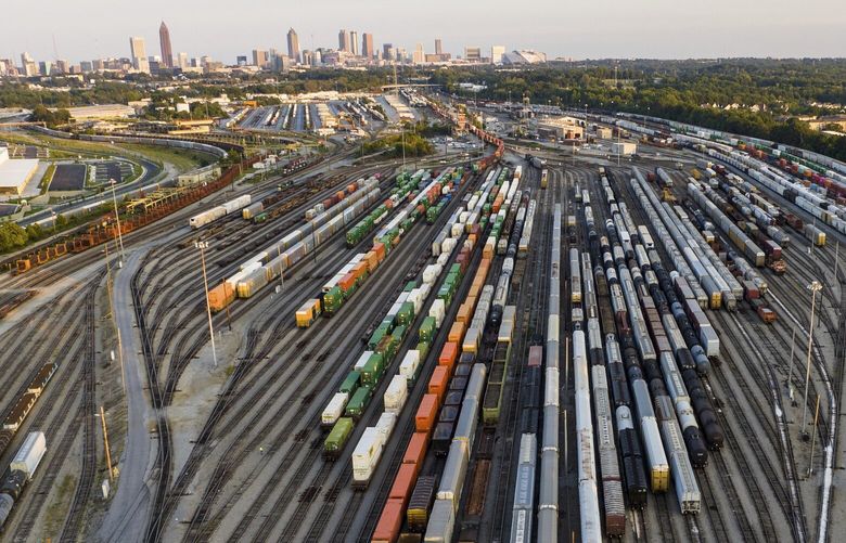 FILE – Freight train cars sit in a Norfolk Southern rail yard on Sept. 14, 2022, in Atlanta. Business groups are increasing the pressure on lawmakers to intervene and block a railroad strike before next month’s deadline in the stalled contract talks. A coalition of more than 400 business groups sent a letter to Congressional leaders Monday, Nov. 28, 2022 urging them to step in because of fears about the devastating potential impact of a strike that could force many businesses to shut down. (AP Photo/Danny Karnik, File) NYPS207 NYPS207
