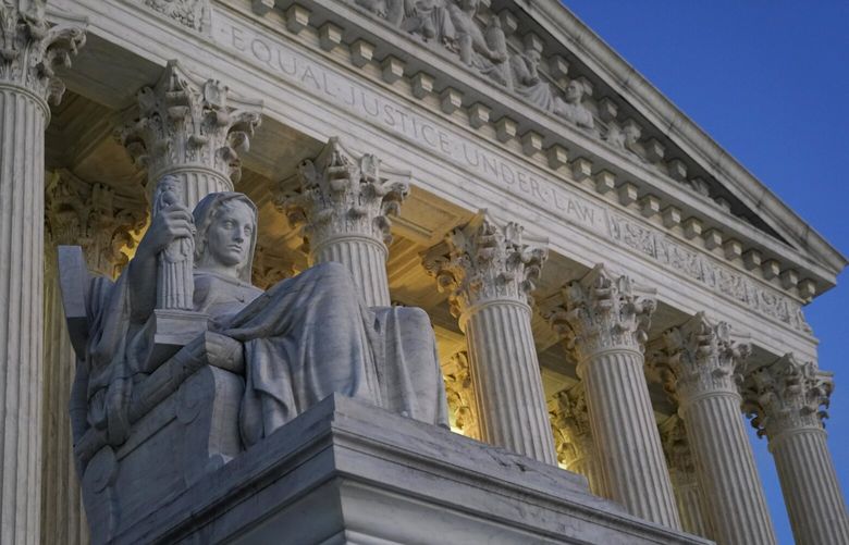 Light illuminates part of the Supreme Court building on Capitol Hill in Washington, Wednesday, Nov. 16, 2022. The Biden administration plans to ask the Supreme Court to reinstate the president’s student debt cancellation plan, according to a Thursday legal filing warning that Americans will face financial strain if the plan remains stalled in court when loan payments are scheduled to restart in January. (AP Photo/Patrick Semansky) DCPS203 DCPS203