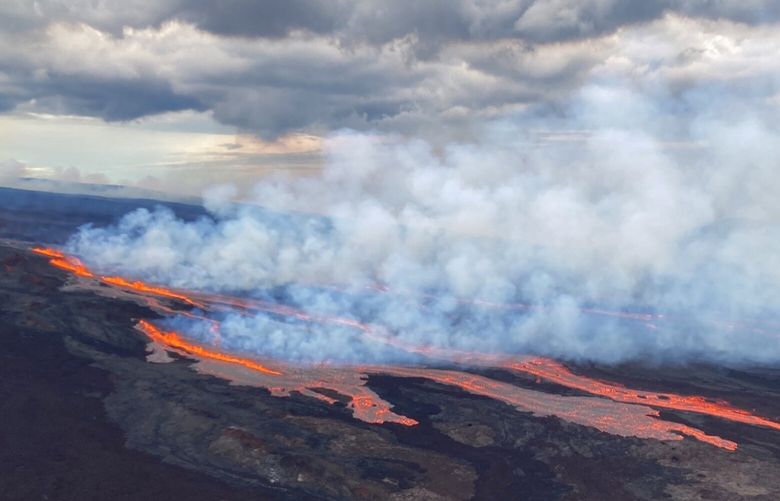 In this aerial photo released by the U.S. Geological Survey, the Mauna Loa volcano is seen erupting from vents on the Northeast Rift Zone on the Big Island of Hawaii, Monday, Nov. 28, 2022. Hawaii’s Mauna Loa, the world’s largest active volcano, began spewing ash and debris from its summit, prompting civil defense officials to warn residents on Monday to prepare in case the eruption causes lava to flow toward communities. (U.S. Geological Survey via AP) FX102 FX102