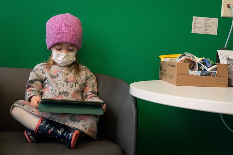 Child watches cartoon on tablet at Odessa Brown Children’s Clinic in Seattle
