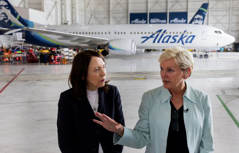 U.S. Sen. Maria Cantwell, D-Wash., left, speaks with U.S. Energy Secretary Jennifer Granholm in August at Sea-Tac International Airport’s Alaska Airlines hangar. In the background is a Boeing 737 MAX 9.