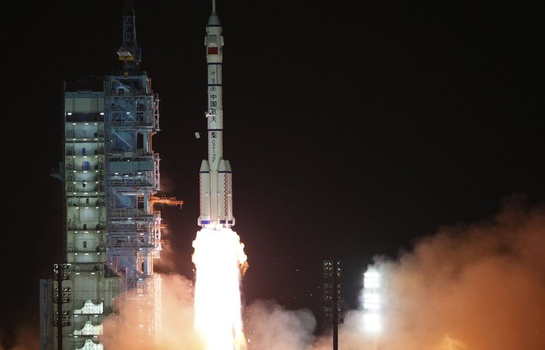 In this photo released by Xinhua News Agency, the manned spaceship Shenzhou-15, atop the Long March-2F Y15 carrier rocket, blasts off from the Jiuquan Satellite Launch Center in northwestern China on Tuesday, Nov. 29, 2022. China launched the rocket Tuesday carrying three astronauts to complete construction of the country’s permanent orbiting space station. (Li Gang/Xinhua via AP) XIN804 XIN804