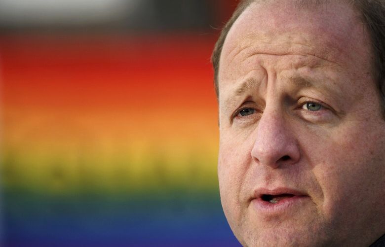 Colorado Gov. Jared Polis speaks at a memorial set up outside Club Q in Colorado Springs, Colo., on Tuesday, Nov. 29, 2022. Polis, the first openly gay man to be elected governor in the United States, paid tribute to the five victims who were killed when a shooter opened fire at the gay nightclub Nov. 19. (AP Photo/ Thomas Peipert) RPTP105 RPTP105