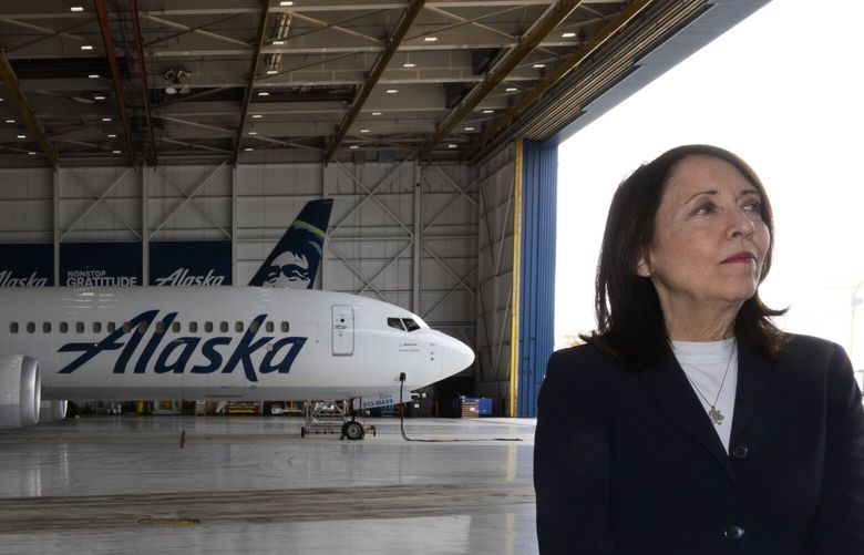 U.S. Senator Maria Cantwell (D-WA) waits for U.S. Energy Secretary Jennifer Granholm to arrive for a interview with reporters, Wednesday, Aug. 10, 2022 at Sea-Tac Airport’s Alaska Airlines hanger. In the background is a Boeing 737-9 MAX.