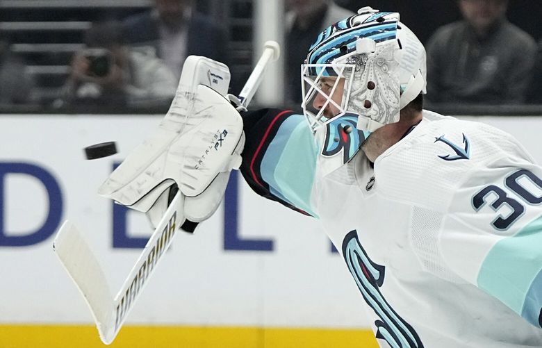 Seattle Kraken goaltender Martin Jones deflects a shot during the second period of an NHL hockey game against the Los Angeles Kings Tuesday, Nov. 29, 2022, in Los Angeles. (AP Photo/Mark J. Terrill) LAS107 LAS107