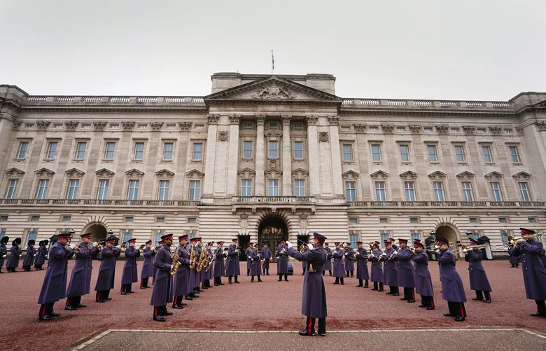 The Band of the Household Cavalry perform on the forecourt of Buckingham Palace prior to the ceremony for the Changing of the Guard to mark the 74th birthday of King Charles III, in London, Monday, Nov. 14, 2022. (Victoria Jones/PA via AP) AMB814 AMB814
