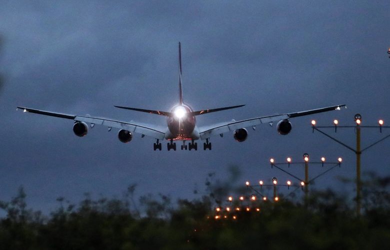 An Airbus A380 aircraft operated by Qantas approaches to land at Sydney Airport in Sydney on Feb. 21, 2019. MUST CREDIT: Bloomberg photo by Brendon Thorne.