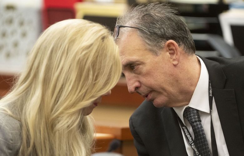 Pierce County Sheriff Ed Troyer talks with his lawyer Anne Bremner prior to jury selection resuming on Wednesday, Nov. 30, 2022, at Pierce County District Court in Tacoma, Wash.