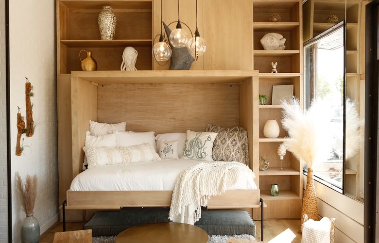 Mod Barn presents a neutral, wooden take on the Murphy bed. (Mod Barn via The New York Times)