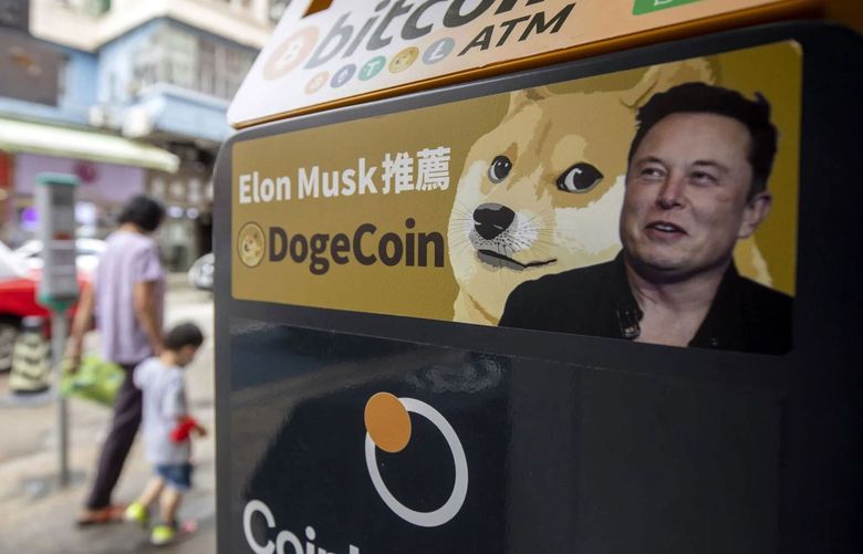 A sticker advertising Dogecoin on a cryptocurrency automated teller machine (ATM) at a laundromat in Hong Kong, China, on Thursday, June 9, 2022. Tesla Inc. Chief Executive Elon Musk expressed his interest in Bitcoin and Dogecoin in 2021 and allowed Tesla customers to buy the electric cars with Bitcoin, helping to send the crypto market to record highs. (Bloomberg)