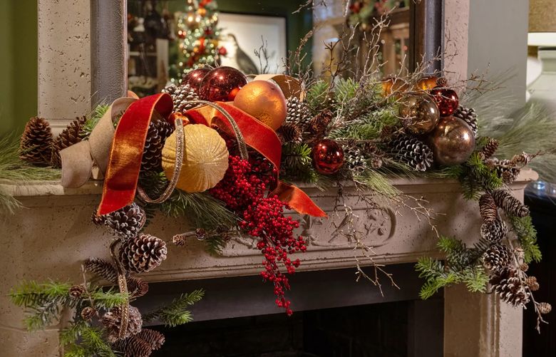 A lopsided mantel vignette lends to the organic style of this design, with more ornaments placed to the left of the garland. (TNS)
