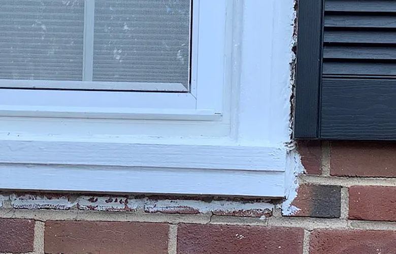 Paint streaks and splatters can mar brick exterior. (Reader photo)
