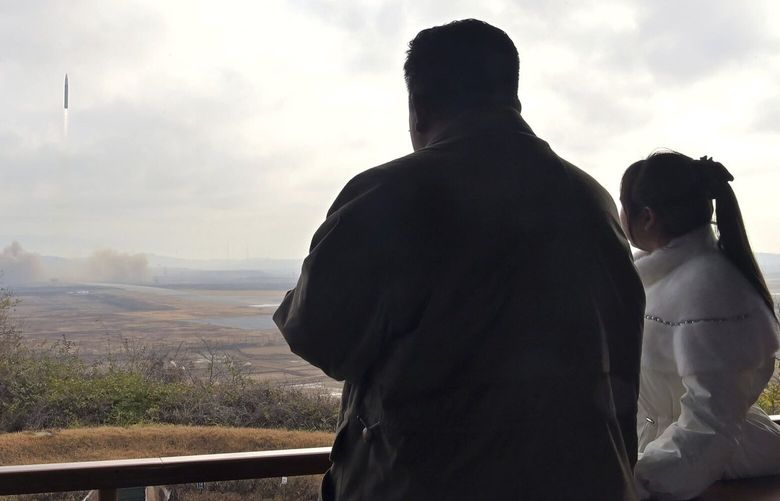 This photo provided on Nov. 19, 2022, by the North Korean government shows North Korean leader Kim Jong Un, left, and his daughter inspect what it says a Hwasong-17 intercontinental ballistic missile at Pyongyang International Airport in Pyongyang, North Korea, Friday, Nov. 18, 2022. Independent journalists were not given access to cover the event depicted in this image distributed by the North Korean government. The content of this image is as provided and cannot be independently verified. (Korean Central News Agency/Korea News Service via AP) KNS809 KNS809
