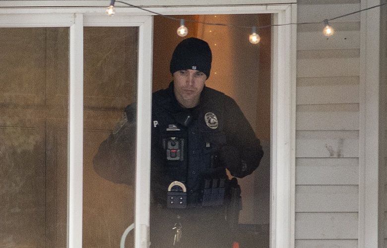 Officers investigate a homicide at an apartment complex south of the University of Idaho campus on Sunday, Nov. 13, 2022. Four people were found dead on King Road near the campus, according to a city of Moscow news release issued Sunday afternoon.
(Zach Wilkinson/Moscow-Pullman Daily News via AP)
