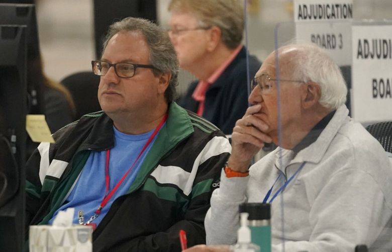 Election adjudicators observe ballot tabulation inside the Maricopa County Recorders Office, Wednesday, Nov. 9, 2022, in Phoenix. (AP Photo/Matt York) AZMY103 AZMY103