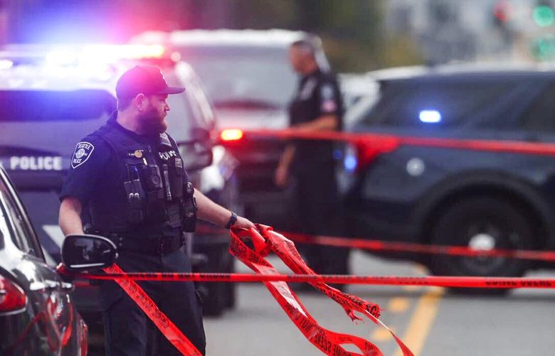 Seattle Police investigate the scene where a pedestrian was hit and killed along 1st Avenue South in the Sodo neighborhood of Seattle Wednesday September 28, 2022. 221719