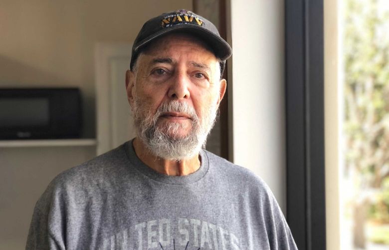 Phil Friedman poses in a clubhouse at his retirement community in Seal Beach, Ca. The 80-year-old Republican and Jewish American says he’s disturbed by the rise of hate speech and bias crimes in the U.S. But he’s also worried that the Democrats could steer the nation toward socialism, in Seal Beach on Friday, Nov. 4, 2022.