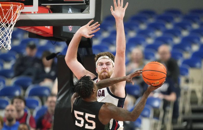 Gonzaga forward Drew Timme, rear, defends against Portland State guard Keshaun Saunders (55) during the second half of an NCAA college basketball game in the Phil Knight Legacy tournament Thursday, Nov. 24, 2022, in Portland, Ore. (AP Photo/Rick Bowmer) UTRB150 UTRB150