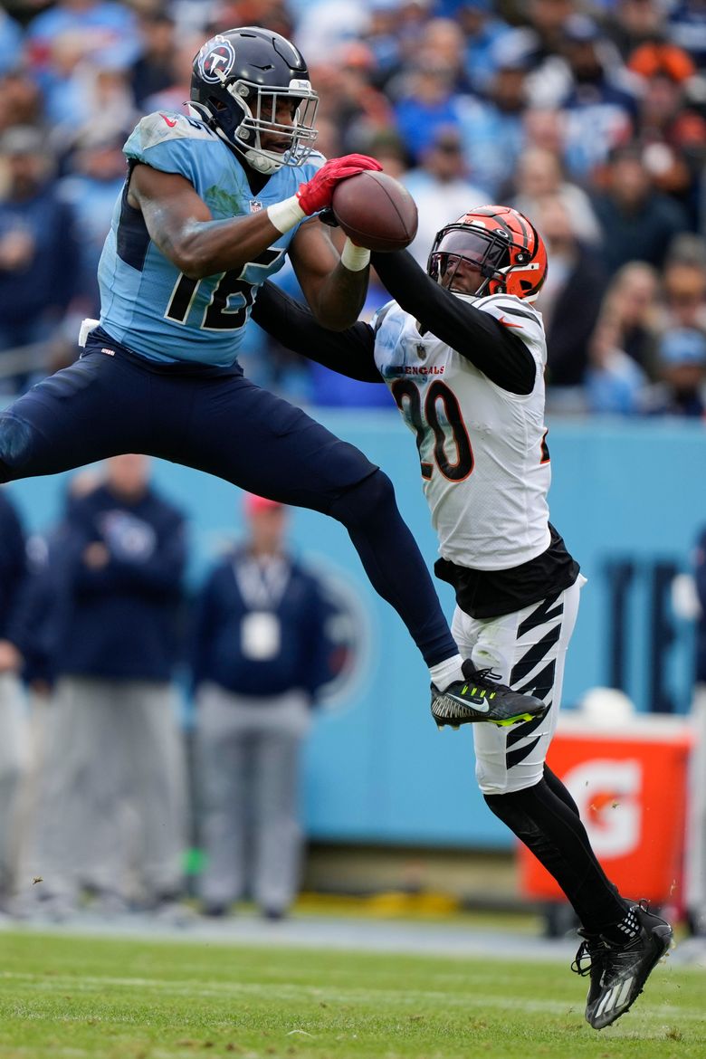 Tennessee Titans' Treylon Burks, with one catch, leaves coach Mike