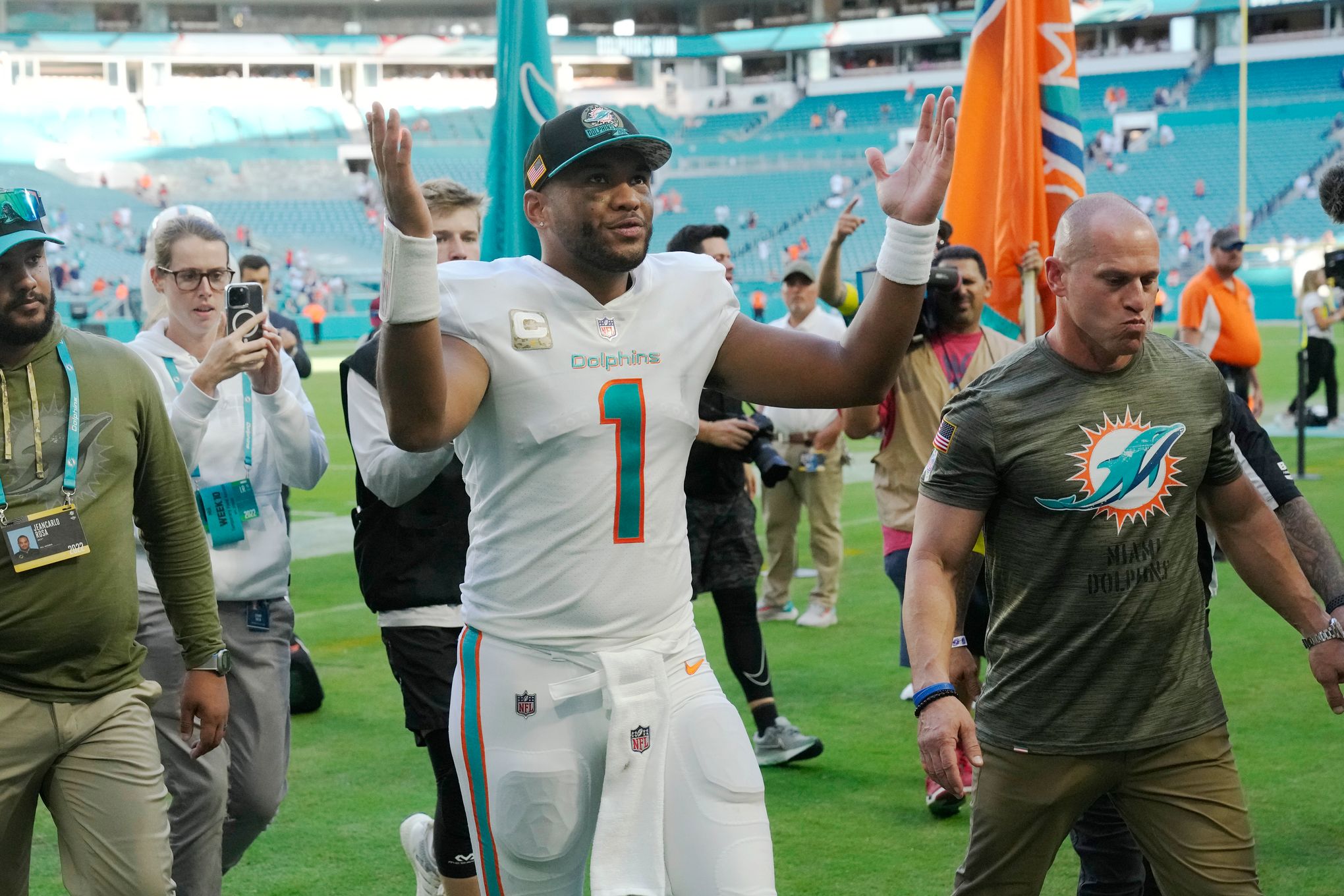 Miami Dolphins quarterback Jacoby Brissett (14) walks the