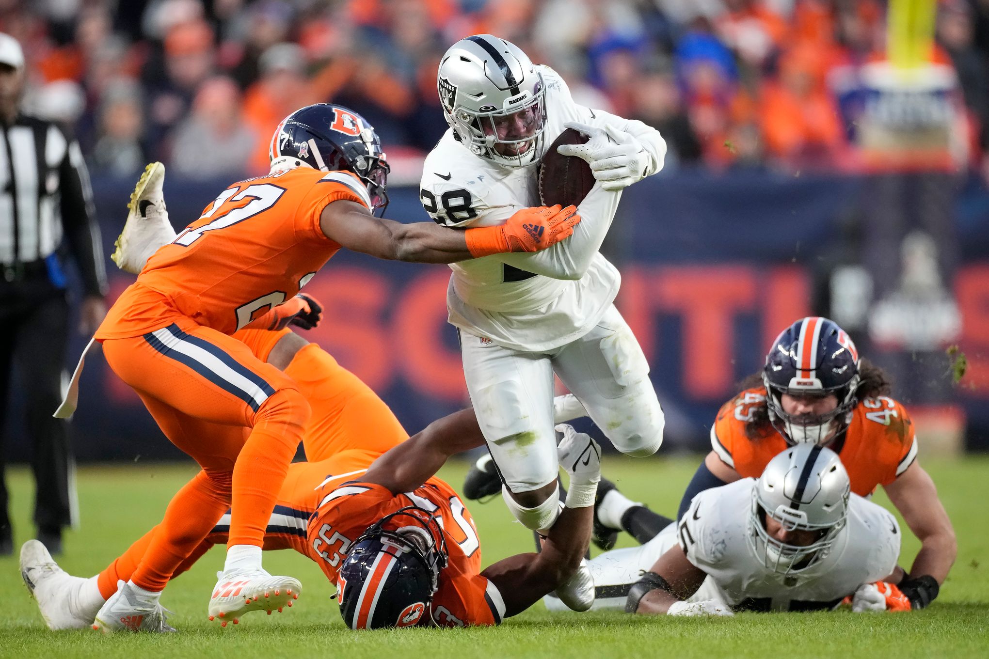 Las Vegas Raiders running back Josh Jacobs (28) runs against the