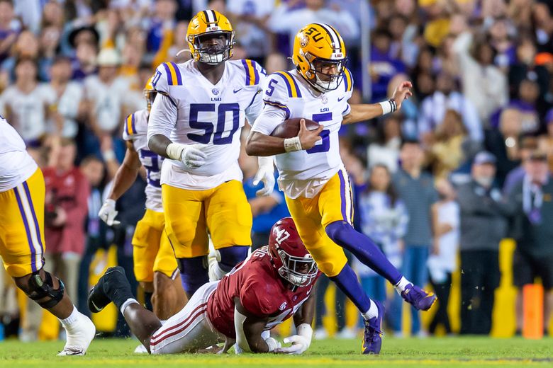 LSU quarterback Jayden Daniels runs the ball against Alabama in an NCAA college football game in Baton Rouge, La., Saturday, Nov. 5, 2022. LSU won 32-31 in overtime. (Scott Clause/The Daily Advertiser via AP)