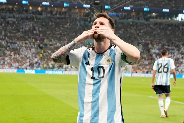 Lionel Messi from Argentina celebrates with the cup after winning