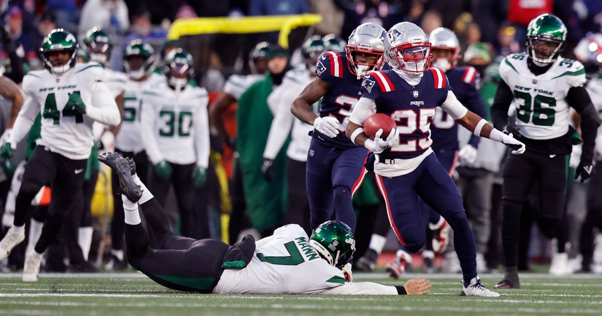 New England Patriots wide receiver Nelson Agholor, left, takes a hand off  from quarterback Mac Jones during the first half of an NFL football game  against the Buffalo Bills in Orchard Park