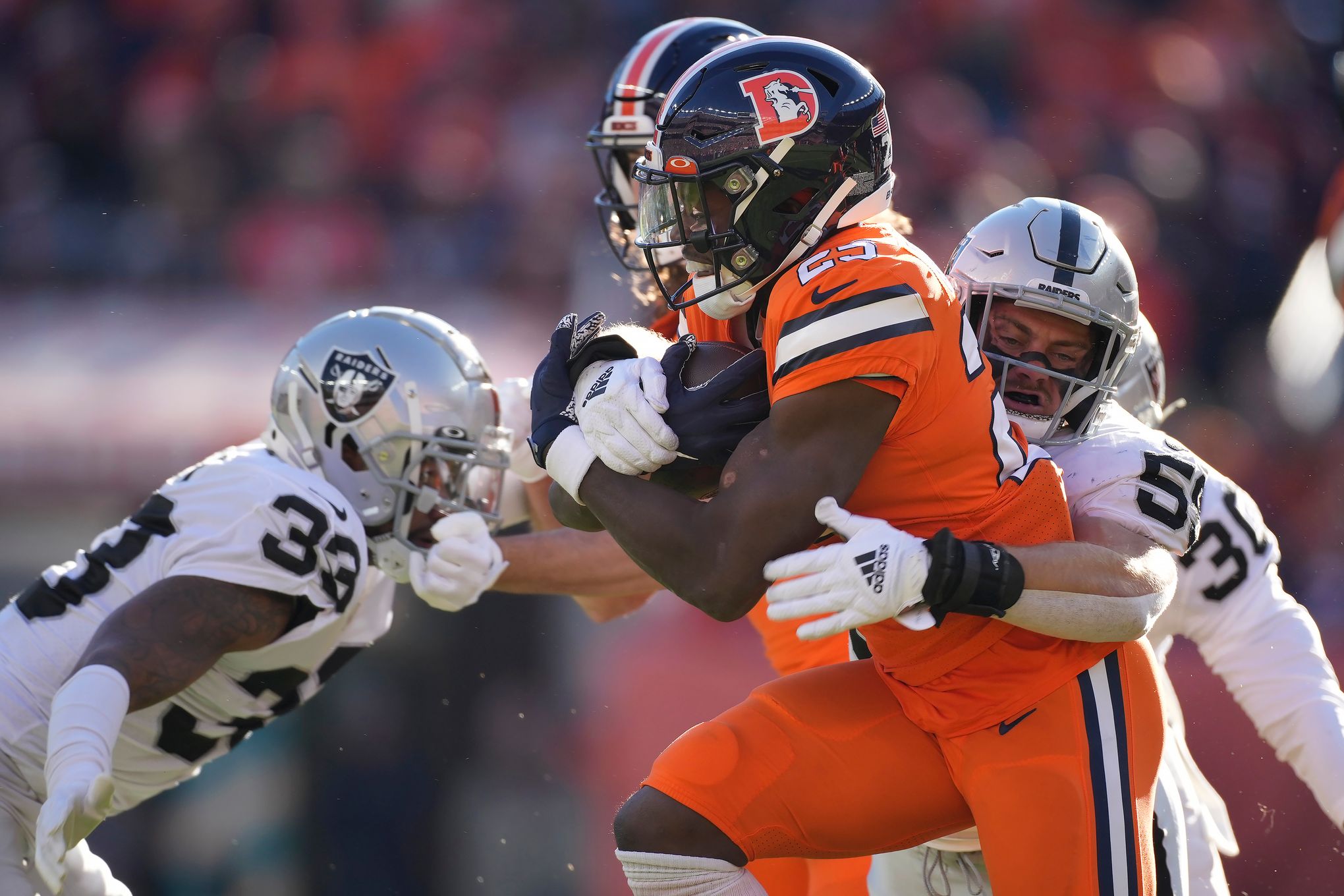 Raiders win first game of the season, defeat Broncos 32-23