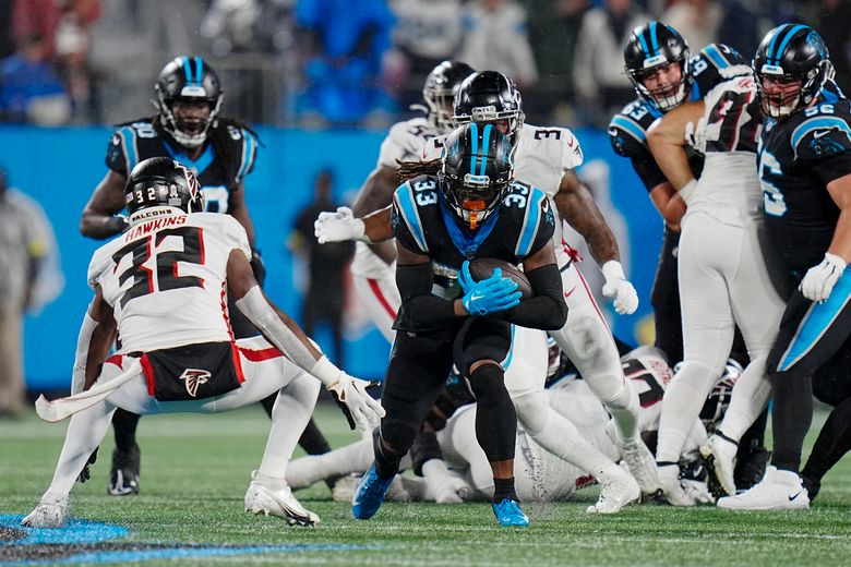 Foreman leads Panthers past rival Falcons in rain, 25-15