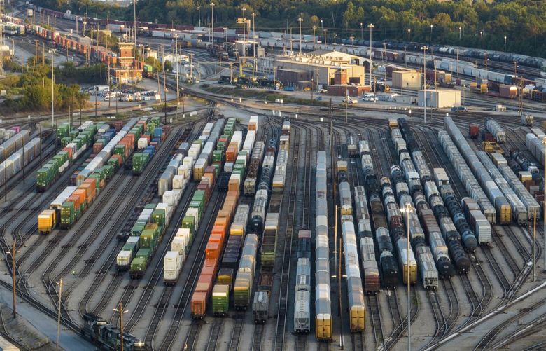 FILE – Freight train cars sit in a Norfolk Southern rail yard on Sept. 14, 2022, in Atlanta. The Biden administration is saying the U.S. economy would face a severe economic shock if senators don’t pass legislation this week to avert a rail worker strike. The administration is delivering that message personally to Democratic senators in a closed-door session Thursday, Dec. 1. (AP Photo/Danny Karnik, File) WX105 WX105