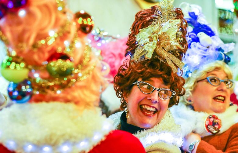 The Beaconettes, with their beehive hairdos and lights, bring their topical humor to the 2014 Great Figgy Pudding Caroling competition at Westlake Center. This year’s event is Friday, Dec. 2 at Pike place Market from 6pm-830pm. The event helps raise money for the Pike Market Senior Center and Food Bank. 0431653241