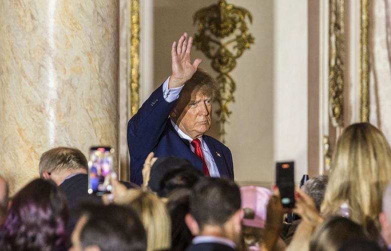 FILE – Former President Donald Trump greets supporters at his resort home Mar-a-Lago in Palm Beach, Fla., on Nov. 15, 2022. The guilty verdict against Stewart Rhodes, the head of the far-right Oath Keepers militia, and one of his subordinates, effectively established that there was an illegal plot to keep Trump in power despite his defeat in the 2020 election, whether he was directly involved or simply inspired it through the lies he spread. (Saul Martinez/The New York Times) XNYT233 XNYT233