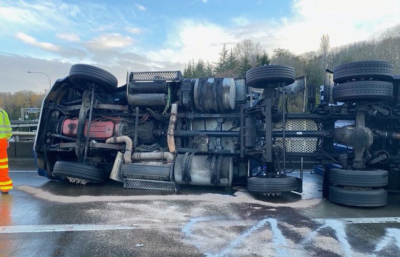 A semi rollover collision fully blocked NB I-5 to the West Seattle Freeway Thursday morning.