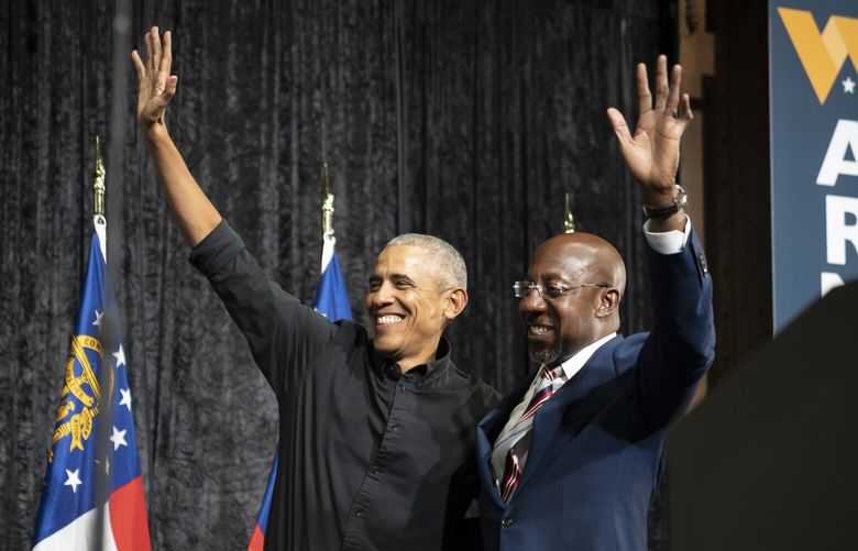Former President Barack Obama, left, with Sen. Raphael Warnock (D-Ga.) during a campaign event for Warnock ahead of the Georgia Runoff Election in Atlanta on Thursday, Dec. 1, 2022. (Nicole Craine/The New York Times) XNYT262 XNYT262