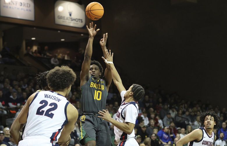 Baylor guard Adam Flagler (10) shoots a fadeaway jump shot during the first half of an NCAA college basketball game against Gonzaga, Friday, Dec. 2, 2022, in Sioux Falls, S.D. (AP Photo/Josh Jurgens) SDJJ107 SDJJ107