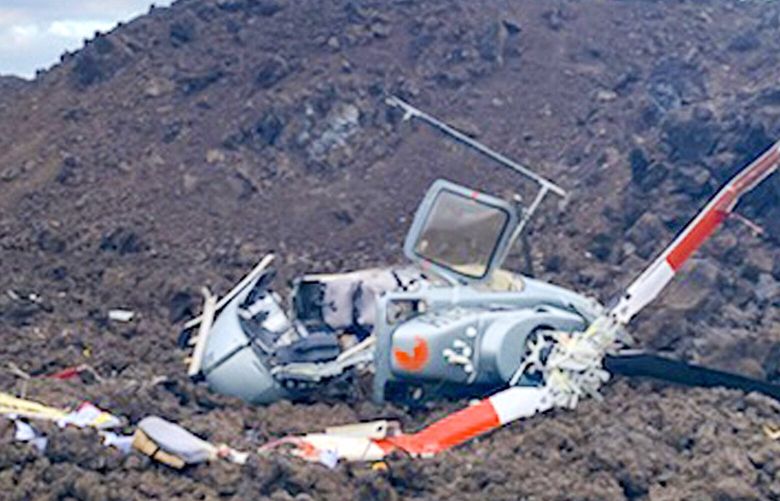 In this photo provided by the Hawaii County Fire Department is the scene where a helicopter crashed in a Big Island lava field in Hawaii on Wednesday, June 8, 2022. Six people on board have been safely evacuated from the site, but two are in serious condition, officials said. Cyrus Johnasen, a public information office for Hawaii County, said it was a tour helicopter with a pilot and five passengers. He said the pilot, a man in his 50s, had been trapped but was later extracted and was in serious but stable condition. (Hawaii County Fire Department via AP) FX406