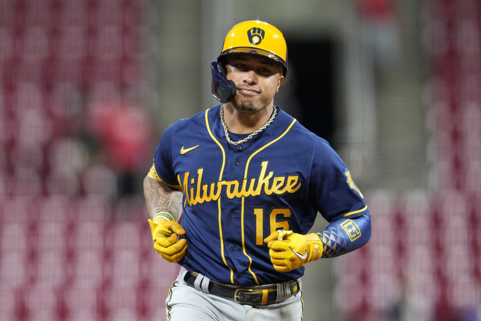 Seattle Mariners second baseman Kolten Wong runs off the field while  wearing an armband for Jackie Robinson Day after the second inning of a  baseball game against the Colorado Rockies, Saturday, April