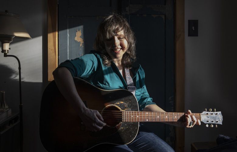 Amy Rigby at home in Catskill, N.Y., on Nov. 2, 2022. The singer-songwriter moved to Catskill with her husband in 2011 and these days she’s writing and producing a podcast. (Lauren Lancaster/The New York Times)