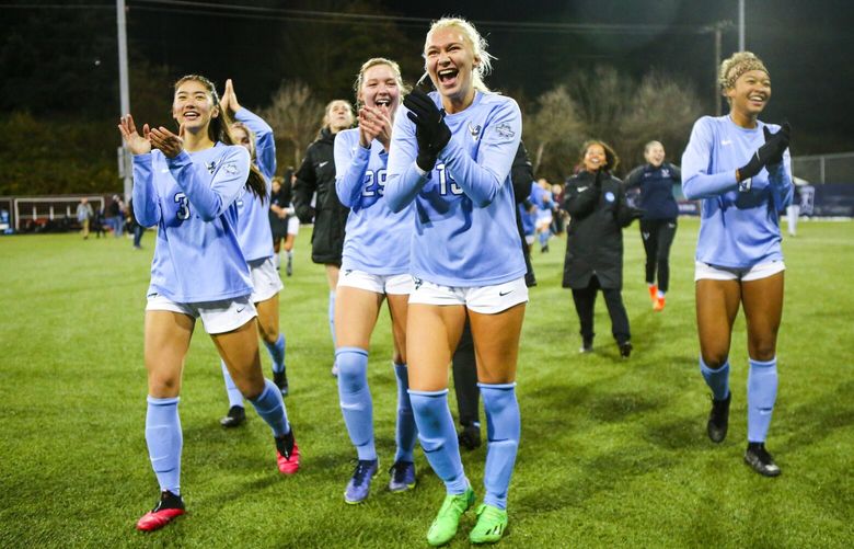 From left, Western Washington University forwards Minji Rauch, Emily Rice, defender Katie Watt and midfielder Payton Neal celebrate after beating West Chester 2-1 to win the NCAA Division II women’s soccer championship Saturday December 3, 2022 at Interbay Soccer Stadium.