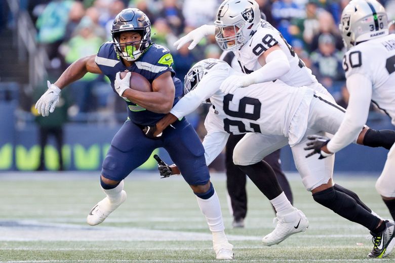 Seattle Seahawks running back Kenneth Walker III (9) runs the ball during  an NFL football game against the Tampa Bay Buccaneers on Nov. 13, 2022, in  Munich. The Buccaneers defeated the Seahawks