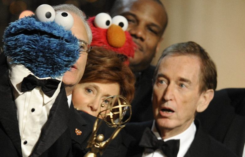 FILE – Bob McGrath, right, looks at the Cookie Monster as they accept the Lifetime Achievement Award for ‘”Sesame Street” at the Daytime Emmy Awards on Aug. 30, 2009, in Los Angeles. McGrath, an actor, musician and childrenâ€™s author widely known for his portrayal of one of the first regular characters on the childrenâ€™s show â€œSesame Streetâ€ has died at the age of 90.  McGrathâ€™s passing was confirmed by his family who posted on his Facebook page on Sunday, Dec. 4, 2022.   (AP Photo/Chris Pizzello, File) NYAB710 NYAB710
