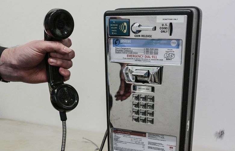 Mike Dank delivered a free pay phone to Iffy Books on Friday. It will be installed there on Dec. 17. (Steven M. Falk/The Philadelphia Inquirer/TNS)