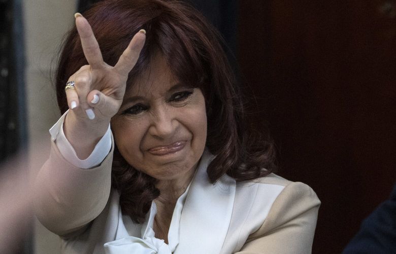FILE – Argentine Vice President Cristina Fernandez greets supporters as she leaves her home in Buenos Aires, Argentina, Aug. 23, 2022. Federal court judges are preparing on Tuesday, Dec. 6, 2022, to announce their verdict in the corruption trial of Fernandez who  is accused of running a criminal organization that defrauded the state of $1 billion during her presidency through public works contracts granted to a construction magnate closely tied to her family. (AP Photo/Rodrigo Abd, File) XLAT107 XLAT107