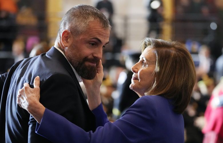 Speaker of the House Nancy Pelosi of Calif., embraces former Washington Metropolitan Police Department officer Michael Fanone before the start of a Congressional Gold Medal ceremony honoring law enforcement officers who defended the U.S. Capitol on Jan. 6, 2021, in the U.S. Capitol Rotunda in Washington, Tuesday, Dec. 6, 2022. (AP Photo/Alex Brandon) DCAB203 DCAB203